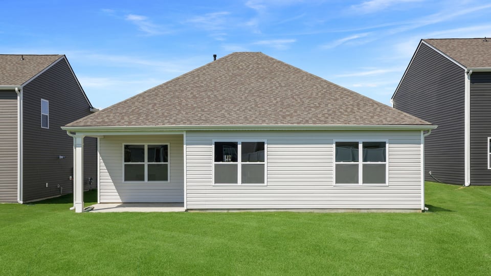Back exterior with large backyard.