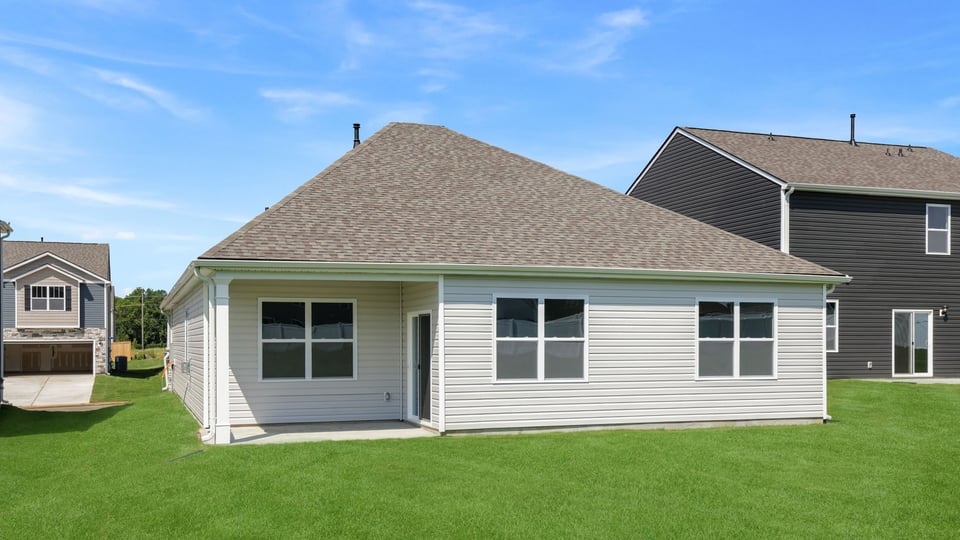 Back exterior with large backyard.