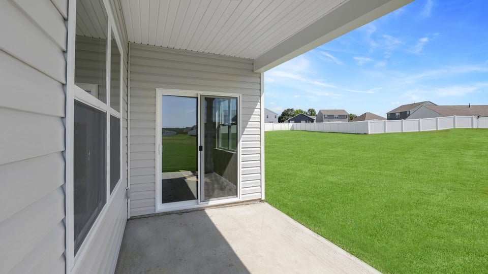 Back exterior with large backyard.