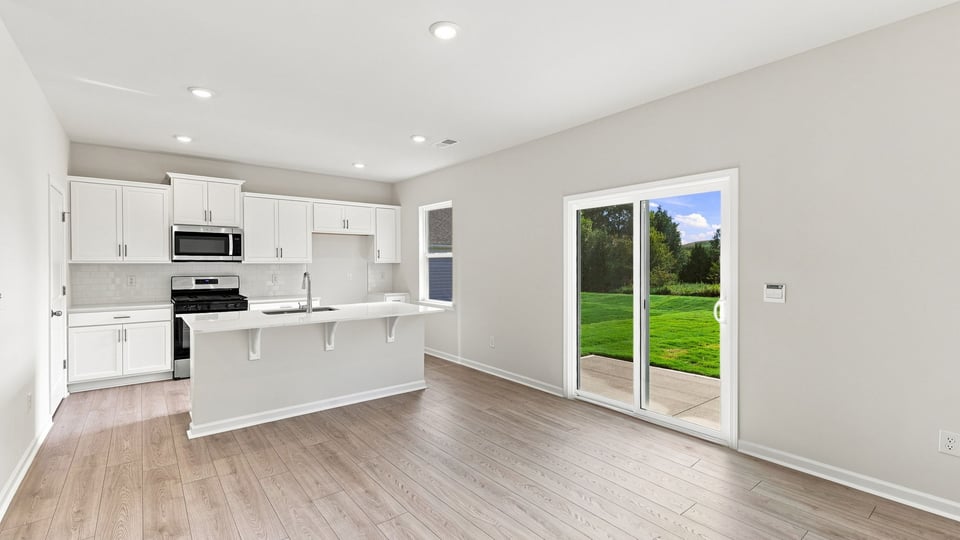 Kitchen with island and cabinets.