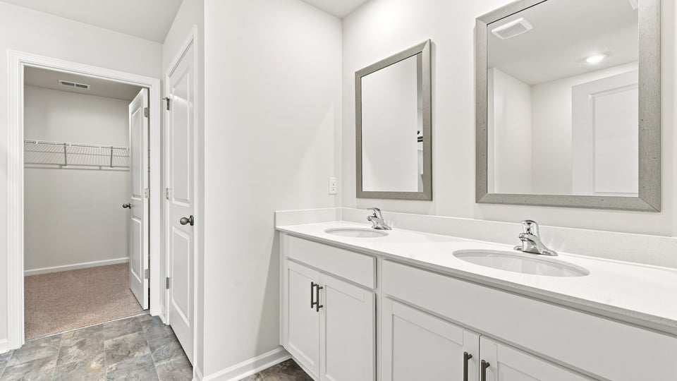 Primary bathroom with double vanity sinks.