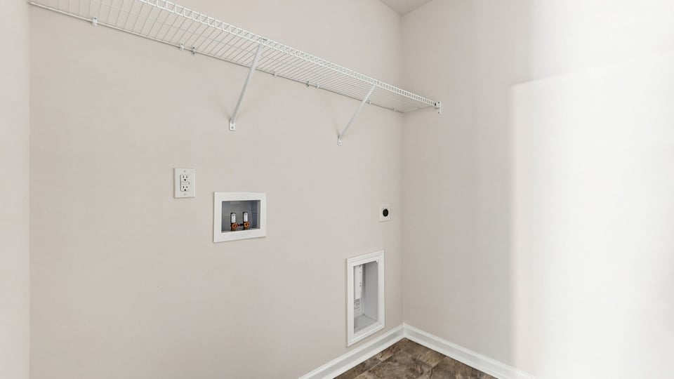 Laundry room with self.