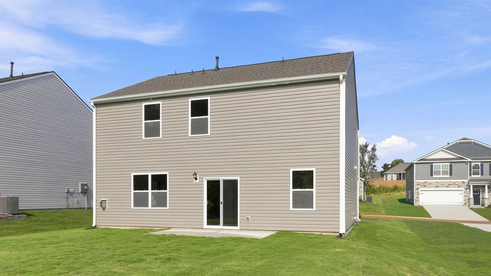 Back exterior with large backyard.