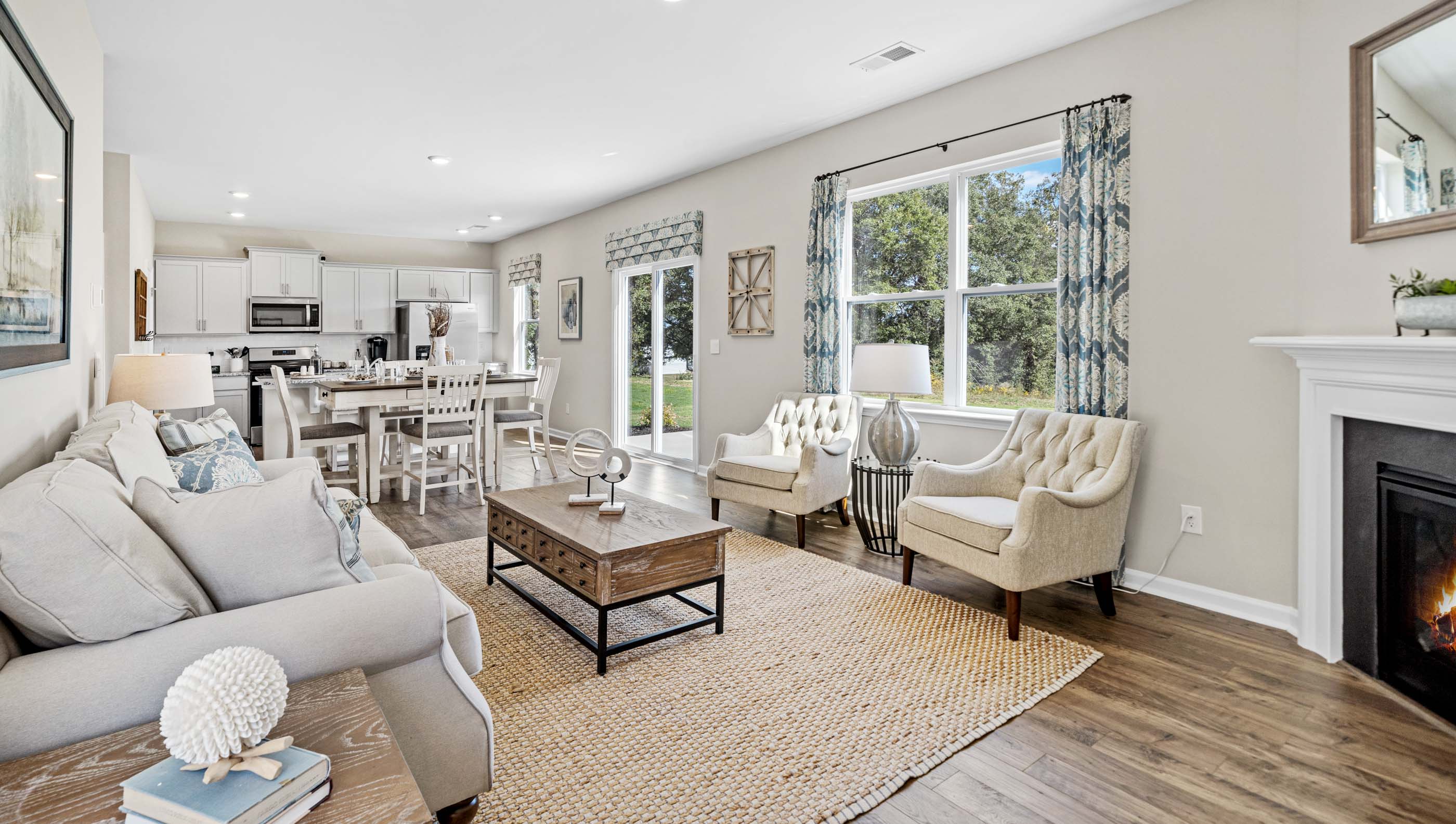 Living area with windows and fireplace.