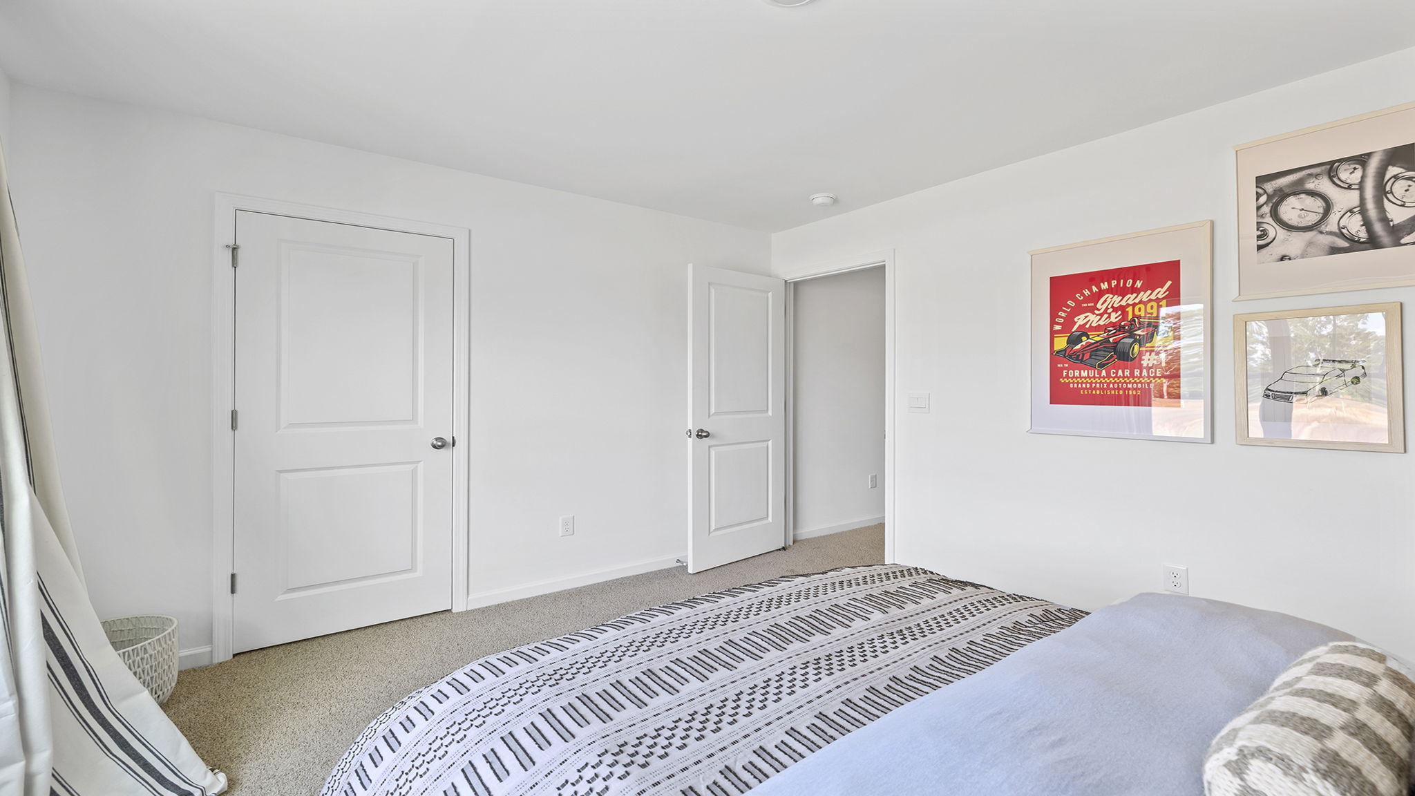 Bedroom with carpet and windows..