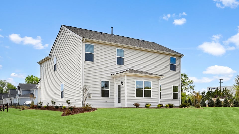 Back exterior with large backyard.