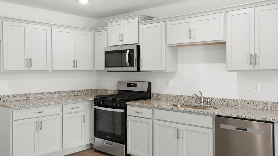 Kitchen with island and countertops.