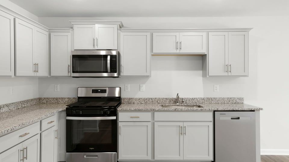 Kitchen with island and countertops.