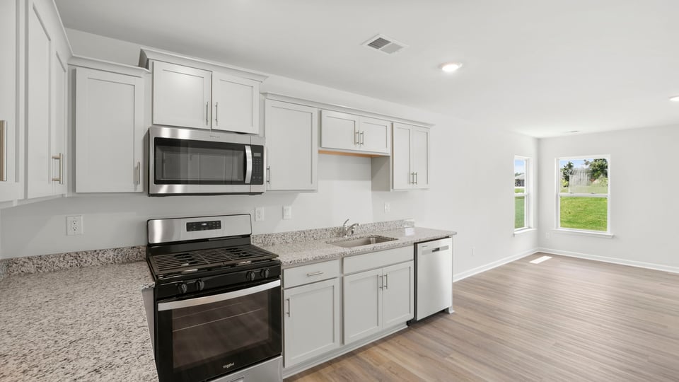 Kitchen with island and countertops.