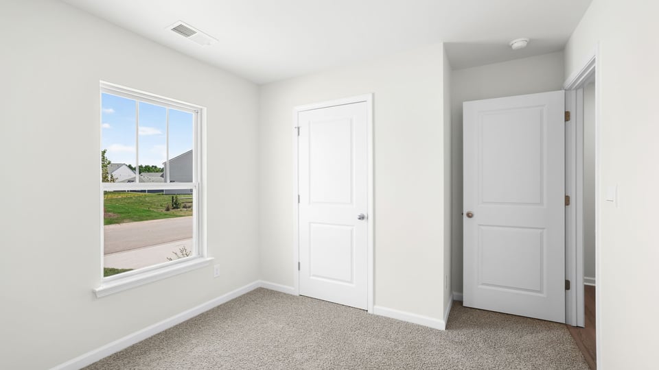 Bedroom with windows.