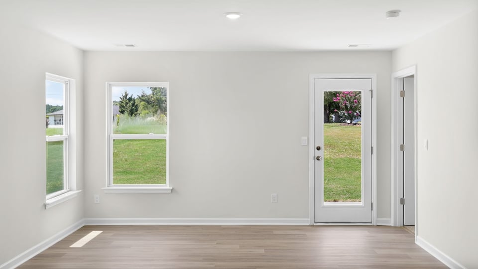 Bedroom with carpet and window.
