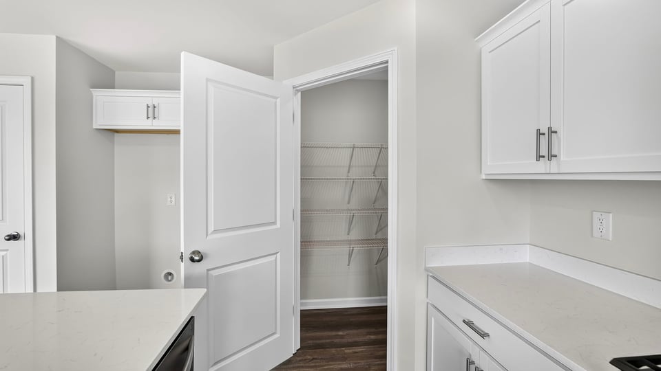 Kitchen and island with quartz countertops.