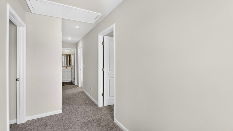 Hallway view of bedrooms.