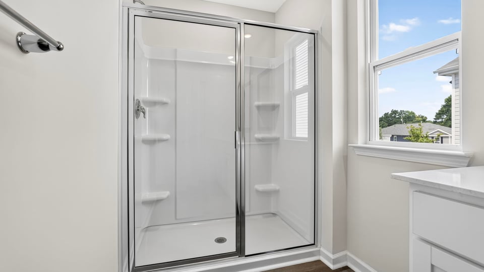 Bathroom with walk in shower.