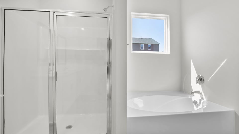 Bedroom with double vanity.