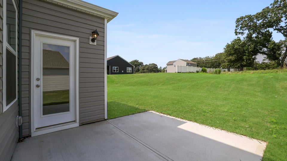 Large backyard of home.