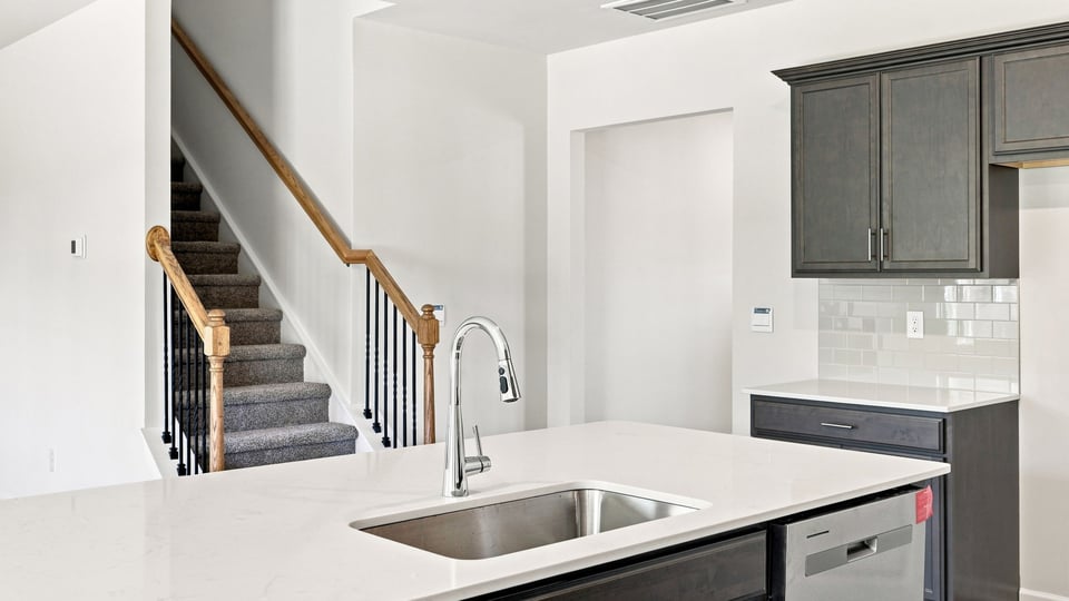 Kitchen with island and cabinets.