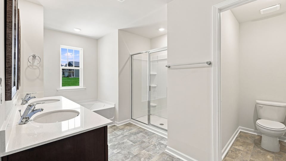 Primary bathroom with double vanity sink.
