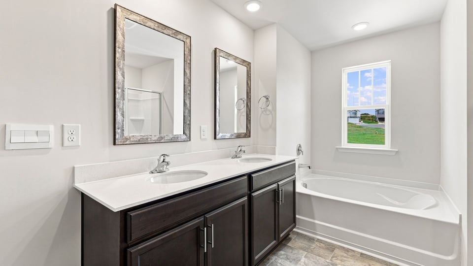 Primary bathroom with double vanity sink.