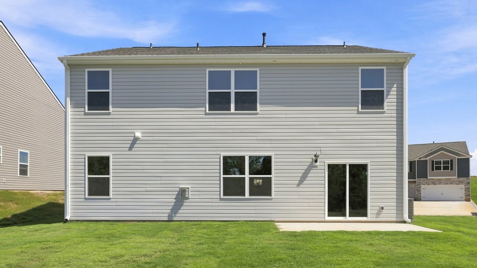 Back exterior with large backyard.