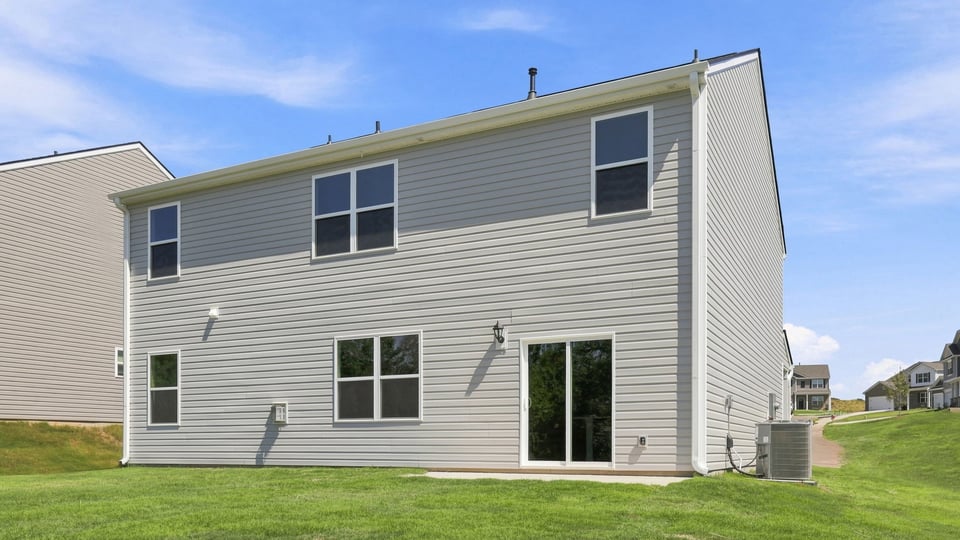 Back exterior with large backyard.