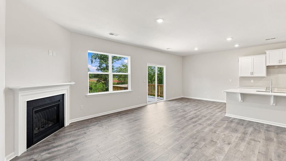Living room with windows and fireplace.