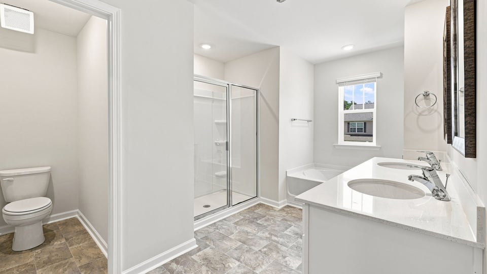 Bathroom with closet and window.