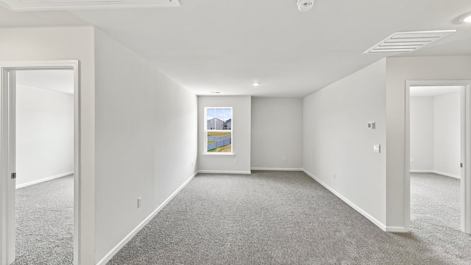 Loft area with carpet.
