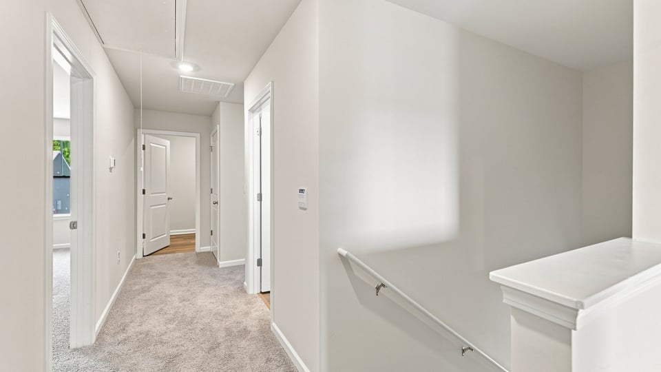Loft area with carpet.