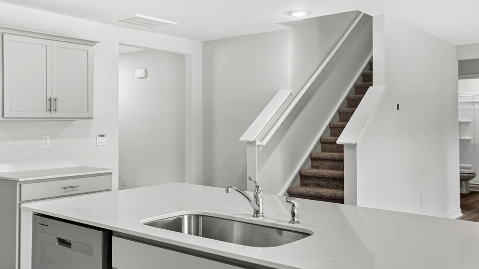 Kitchen with island and cabinets.