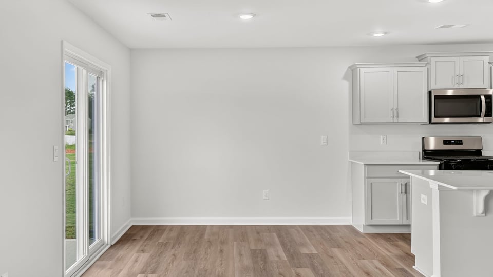 Kitchen with island and cabinets.
