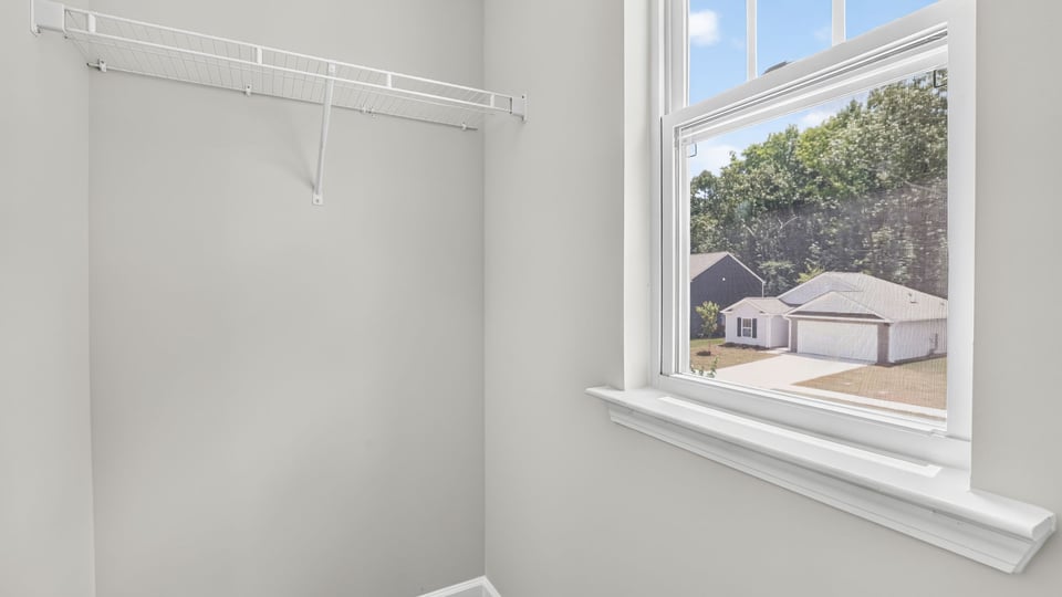 Primary closet with window.