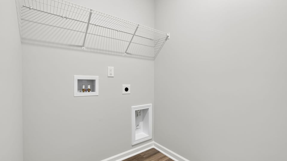 Laundry room with shelf.