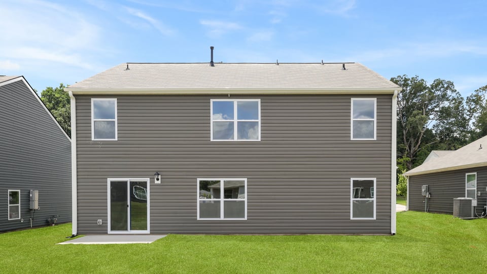 Back exterior with large backyard.