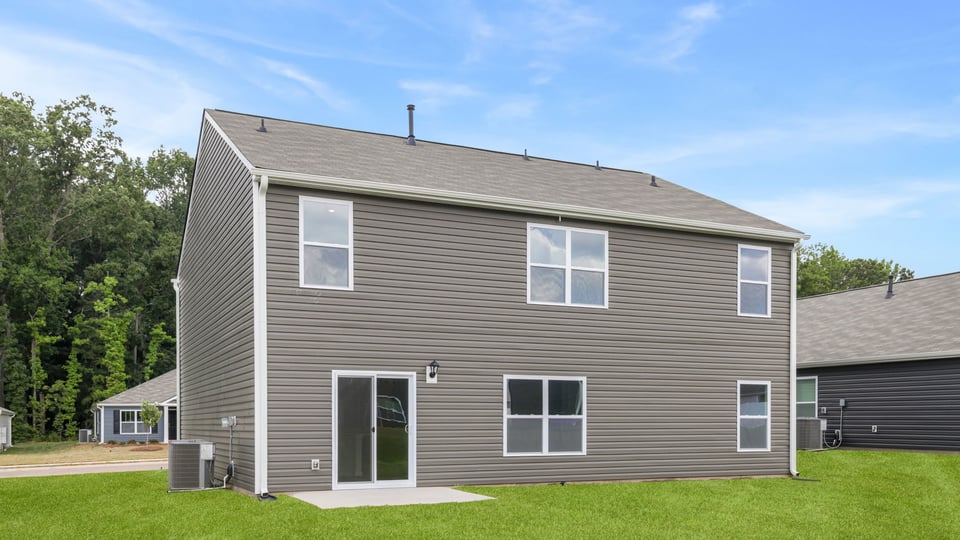 Back exterior with large backyard.