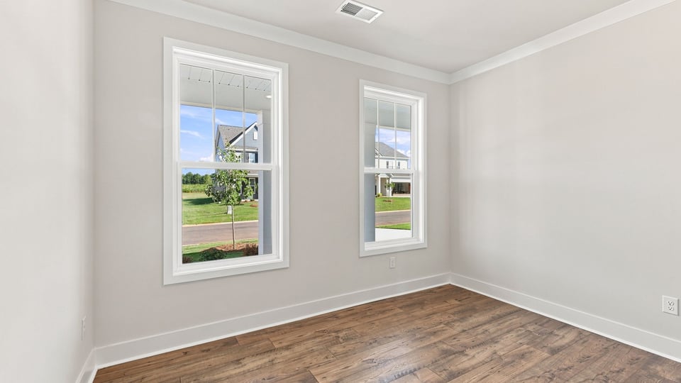 Bedroom with closet and window.