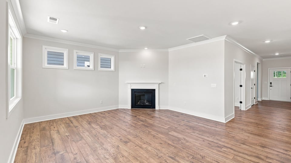Living room with window and fireplace.