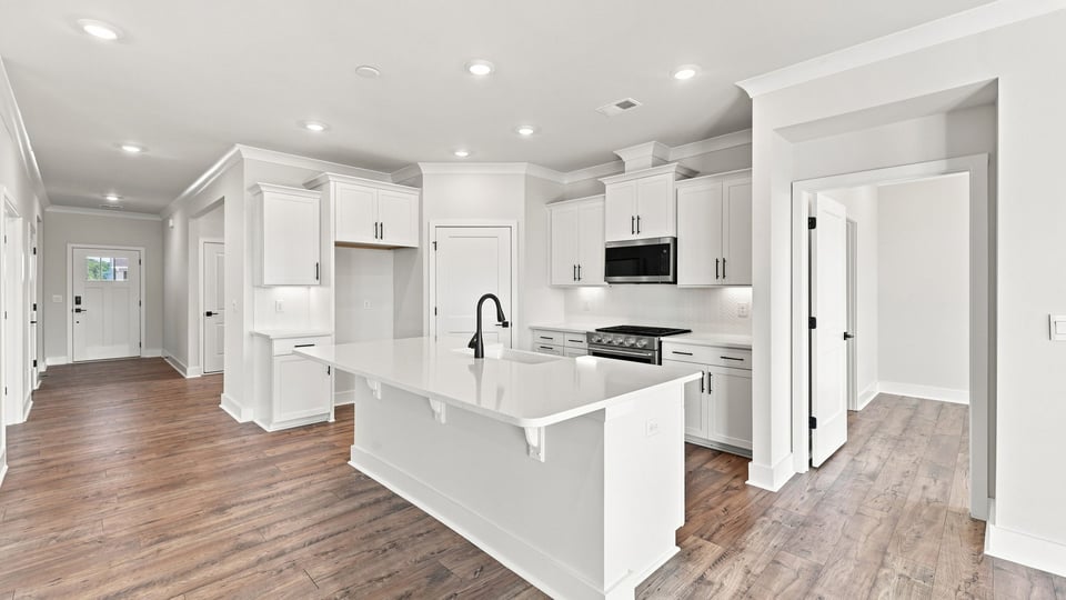 Kitchen with island and cabinets.