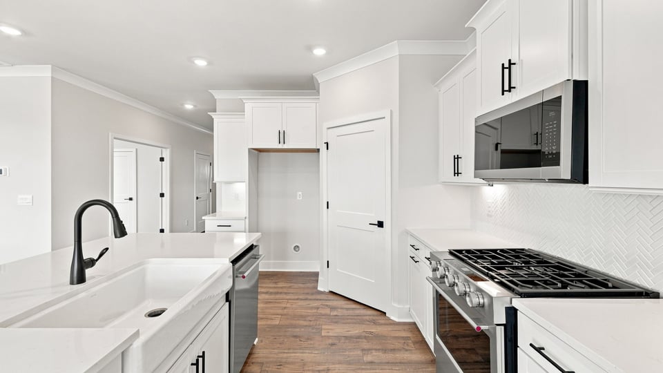 Kitchen with island and cabinets.
