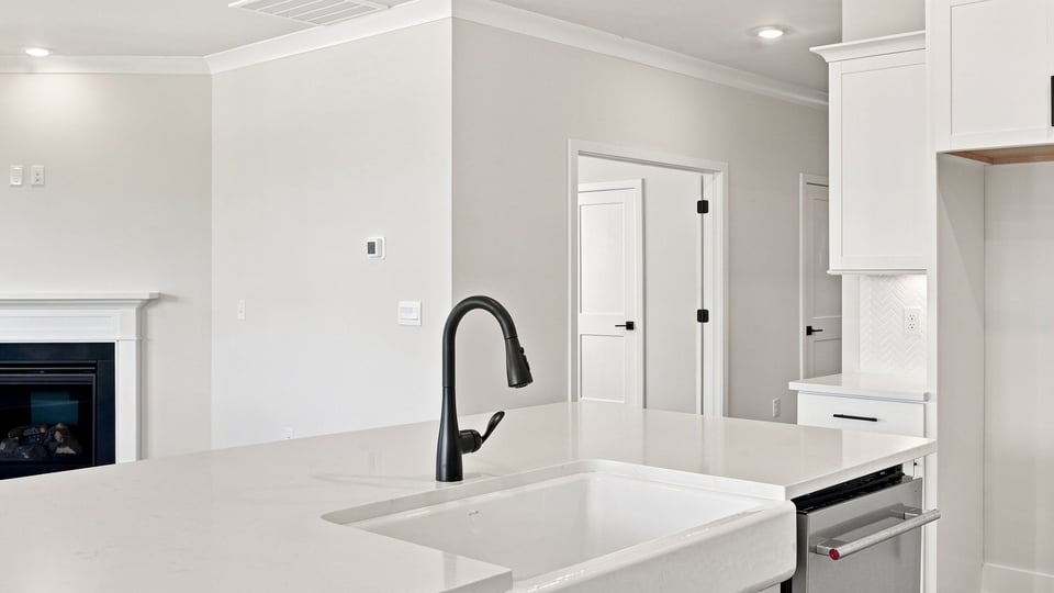Kitchen with island and cabinets.