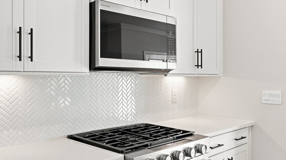 Kitchen with island and cabinets.