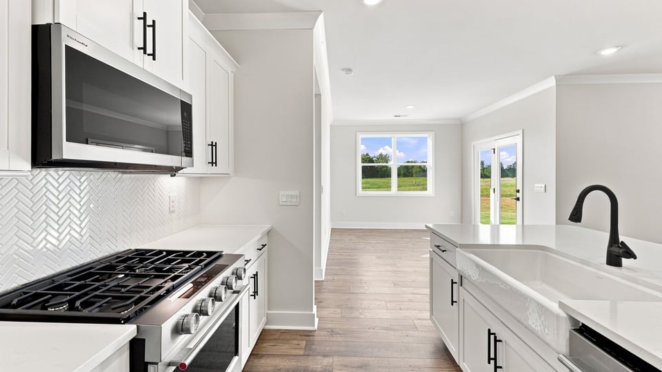 Kitchen with island and cabinets.