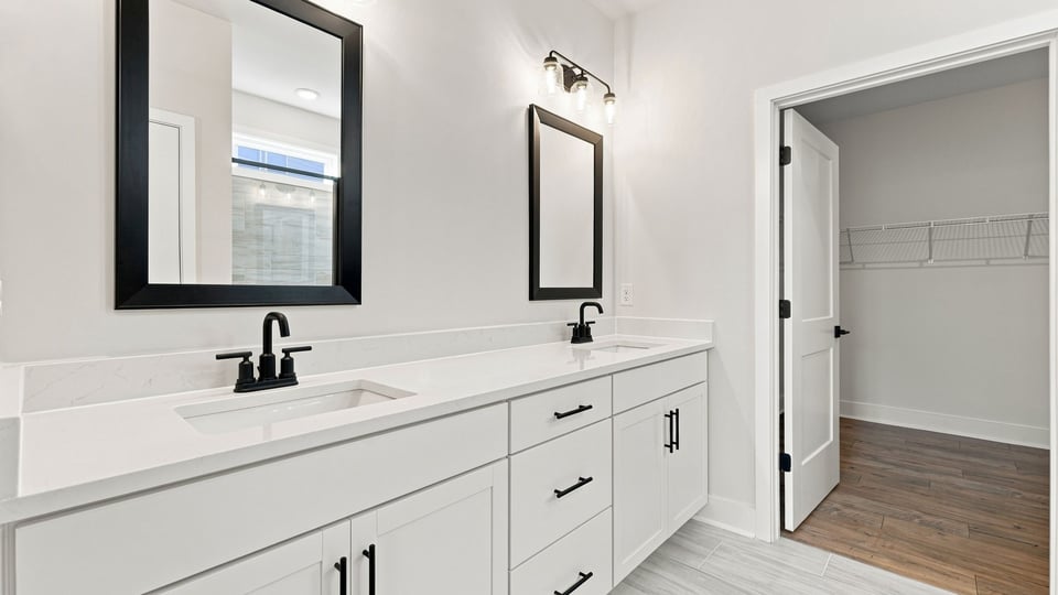Primary bathroom with vanity sinks.