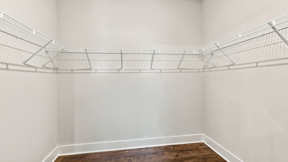 Primary closet with shelf.