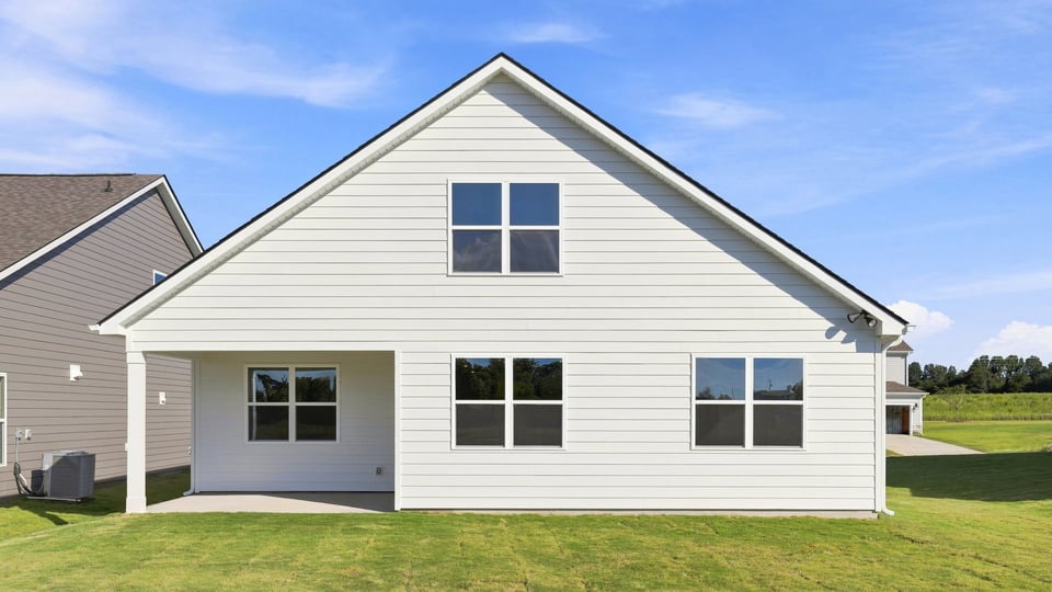 Back exterior with large backyard.