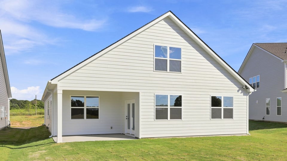 Back exterior with large backyard.