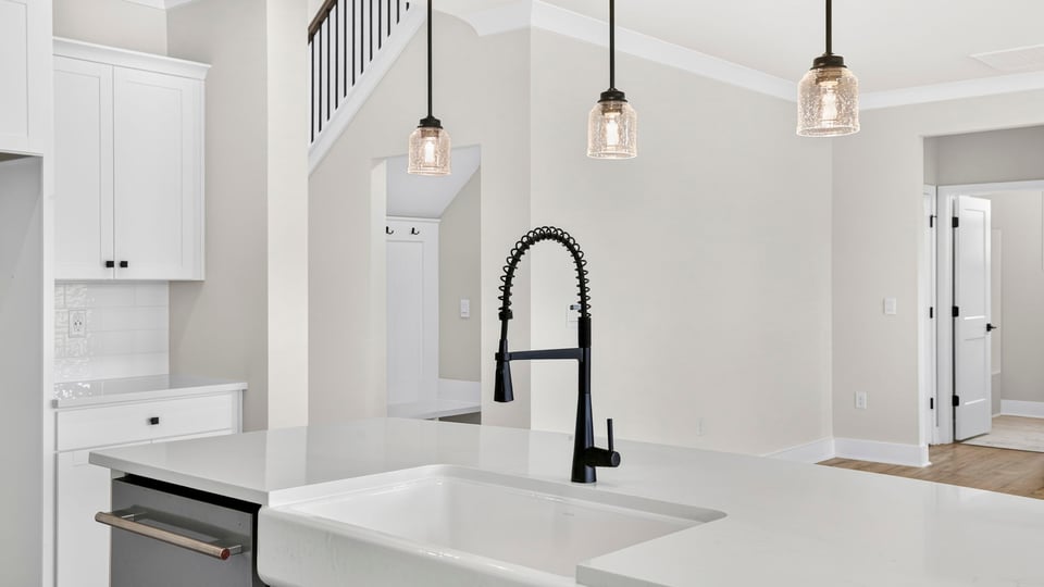 Kitchen and island with quarzt countertops.