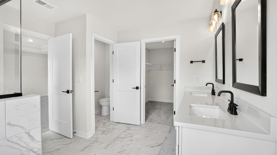 Bathroom with walk in shower and closet.