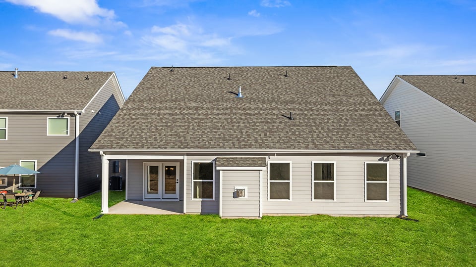 Back exterior with coverd porch.