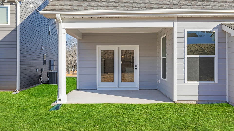 Back exterior with coverd porch.